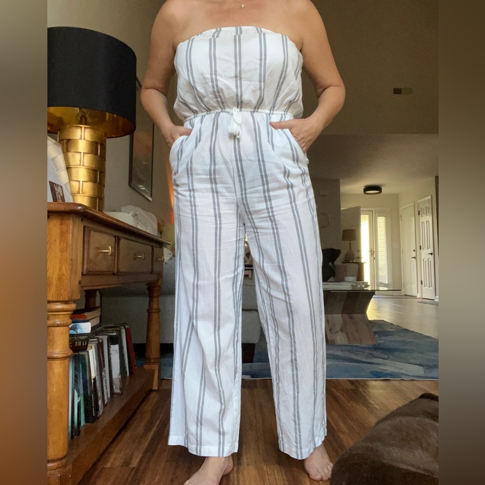 Strapless jumpsuit, white with grey stripes and side pockets. Size large.